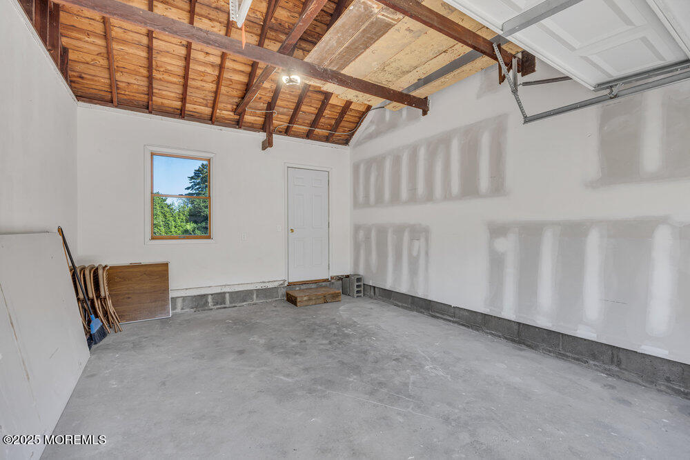717 Holmdel Road Holmdel, NJ 07733 - Photo 31 of 39 a view of an empty room with windows