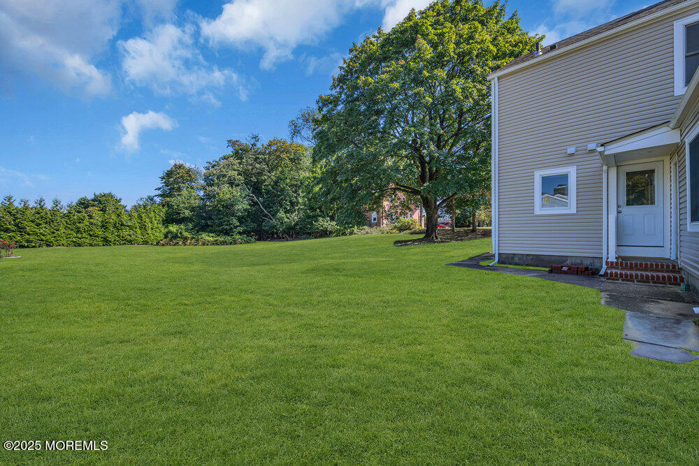 717 Holmdel Road Holmdel, NJ 07733 - Photo 32 of 39 a view of a house with yard and tree s