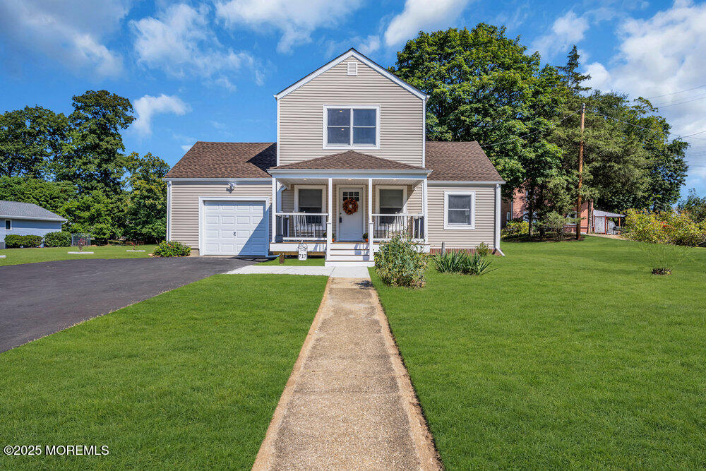 717 Holmdel Road Holmdel, NJ 07733 - Photo 4 of 39 a front view of a house with yard