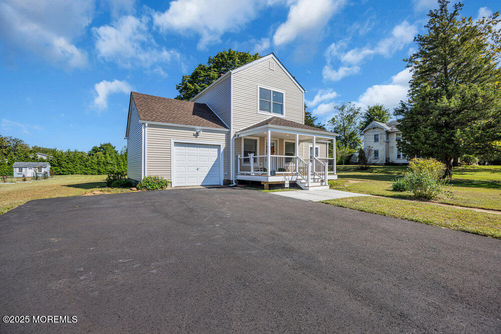 717 Holmdel Road Holmdel, NJ 07733 - Photo 6 of 39 a front view of a house with a yard