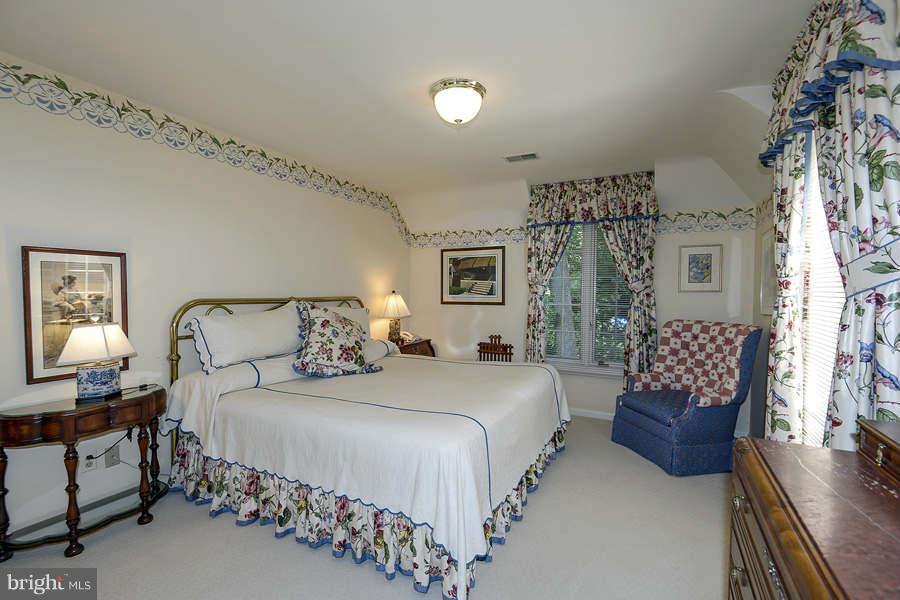 9017 Clewerwall Drive Bethesda, MD 20817 - Photo 16 of 27 a bedroom with bed and window