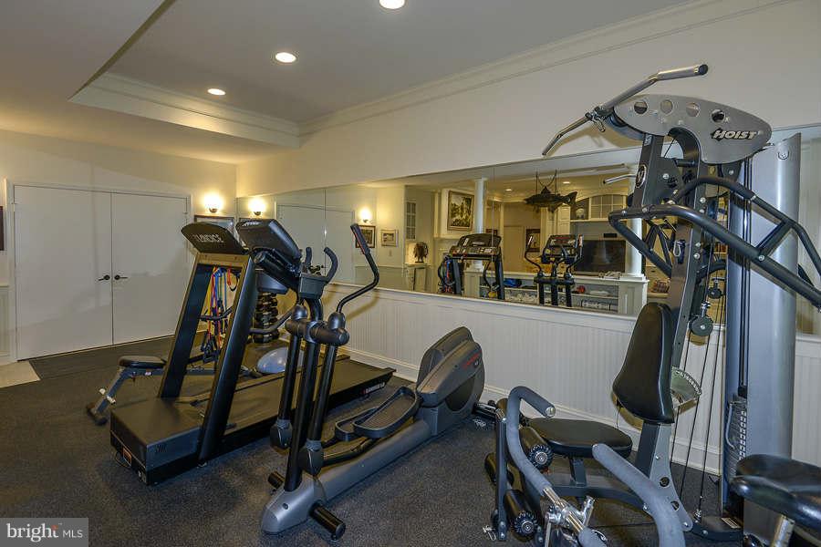 9017 Clewerwall Drive Bethesda, MD 20817 - Photo 21 of 27 a view of a room with gym equipment