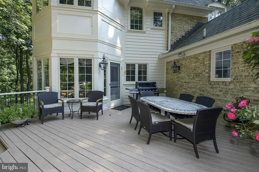 9017 Clewerwall Drive Bethesda, MD 20817 - Photo 23 of 27 a view of a patio with table and chairs