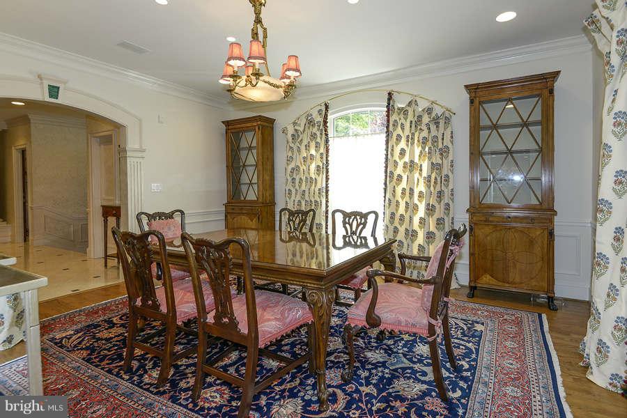 9017 Clewerwall Drive Bethesda, MD 20817 - Photo 4 of 27 a view of a dining room with furniture window and wooden floor