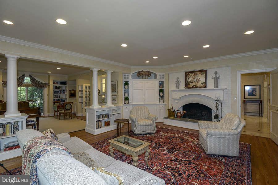 9017 Clewerwall Drive Bethesda, MD 20817 - Photo 7 of 27 a living room with furniture and a fireplace