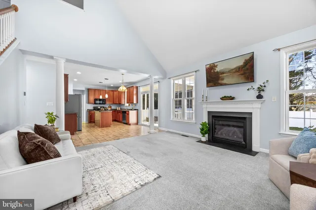 a kitchen with kitchen island granite countertop a sink stove and refrigerator