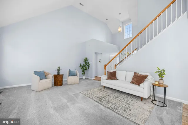 a kitchen with stainless steel appliances granite countertop a stove sink microwave and window