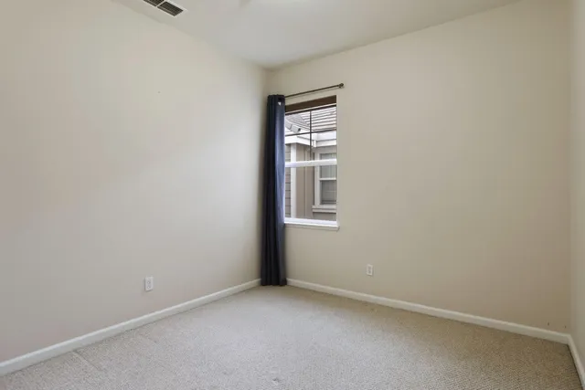 an empty room with closet area