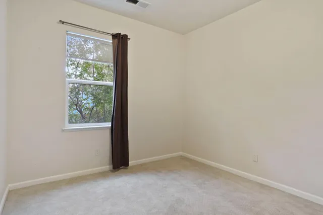 an empty room with closet area