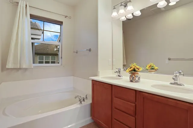 a backyard of a house with table and chairs