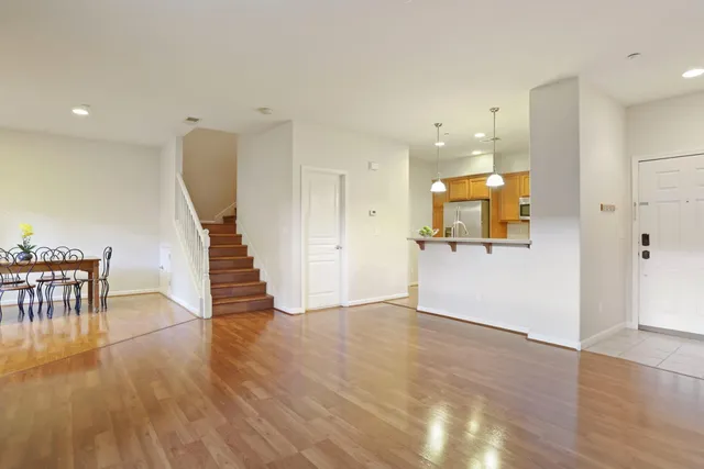 a view of kitchen with furniture and wooden floor
