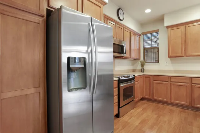 a kitchen with a sink cabinets and window