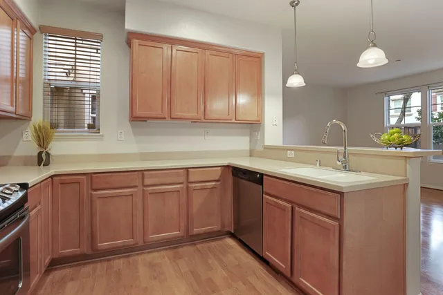 a kitchen with a sink and a window