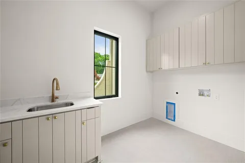 a kitchen with cabinets and window