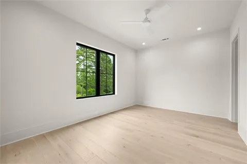 a view of an empty room with a kitchen