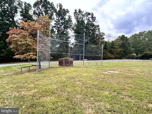 a swimming pool with wooden fence