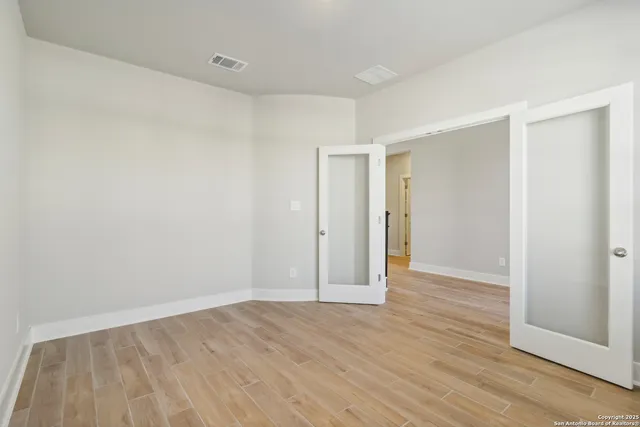 a view of entryway with wooden floor and stairs
