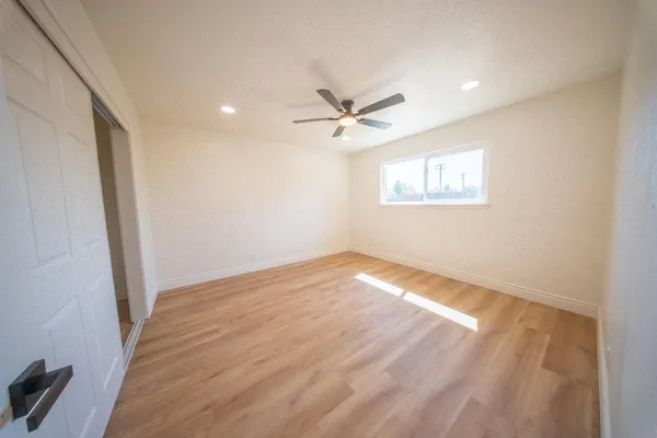a view of an empty room with a window