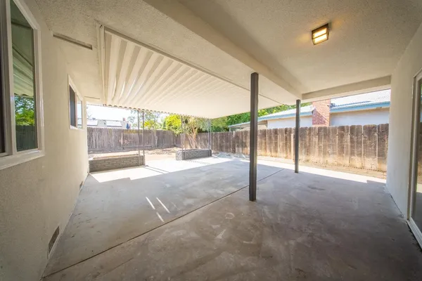a view of empty room with windows