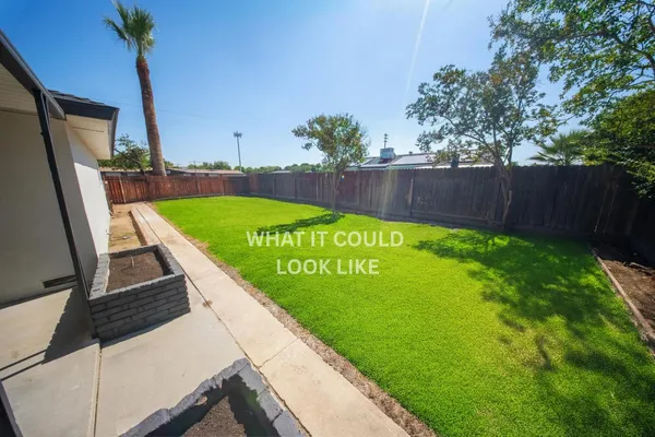 a view of swimming pool with a garden and deck