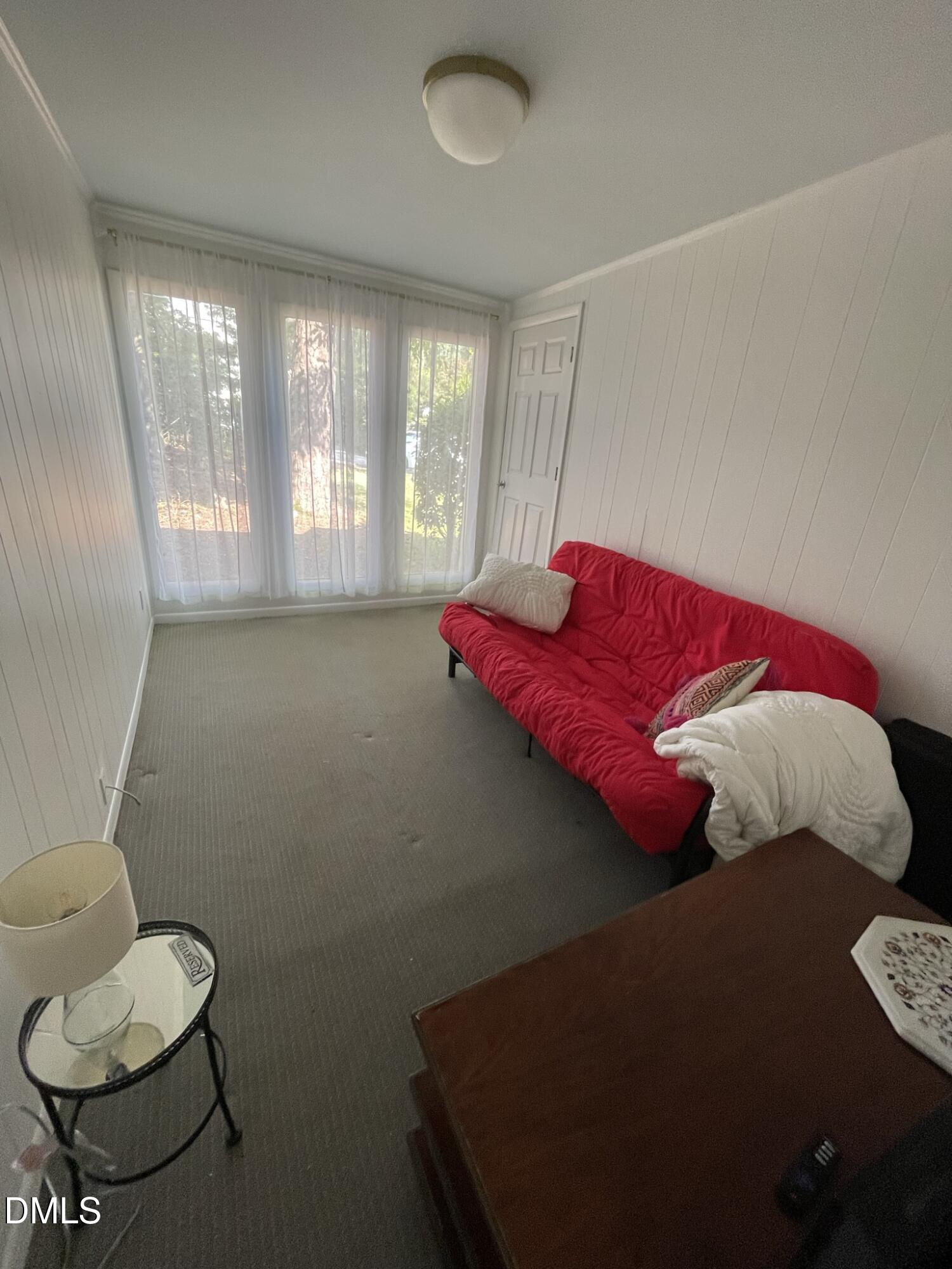 1009 Canterbury Road Raleigh, NC 27607 - Photo 15 of 31 a bedroom with a bed and window