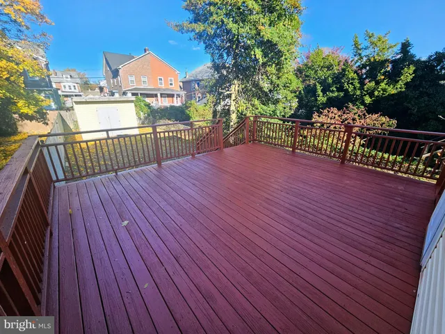 a view of a balcony with wooden floor