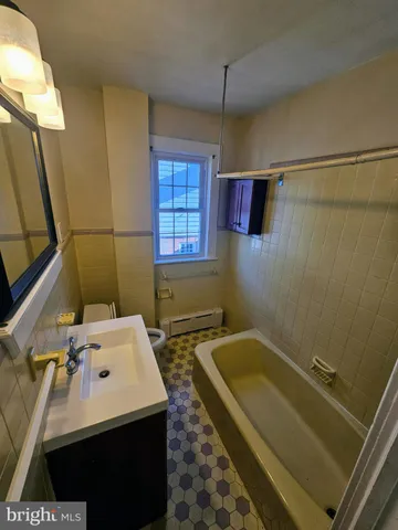 a bathroom with a sink and a bathtub