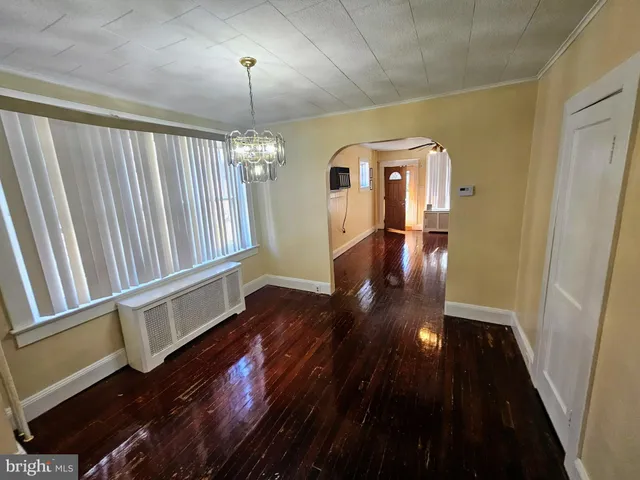 a view of gallery with wooden floor