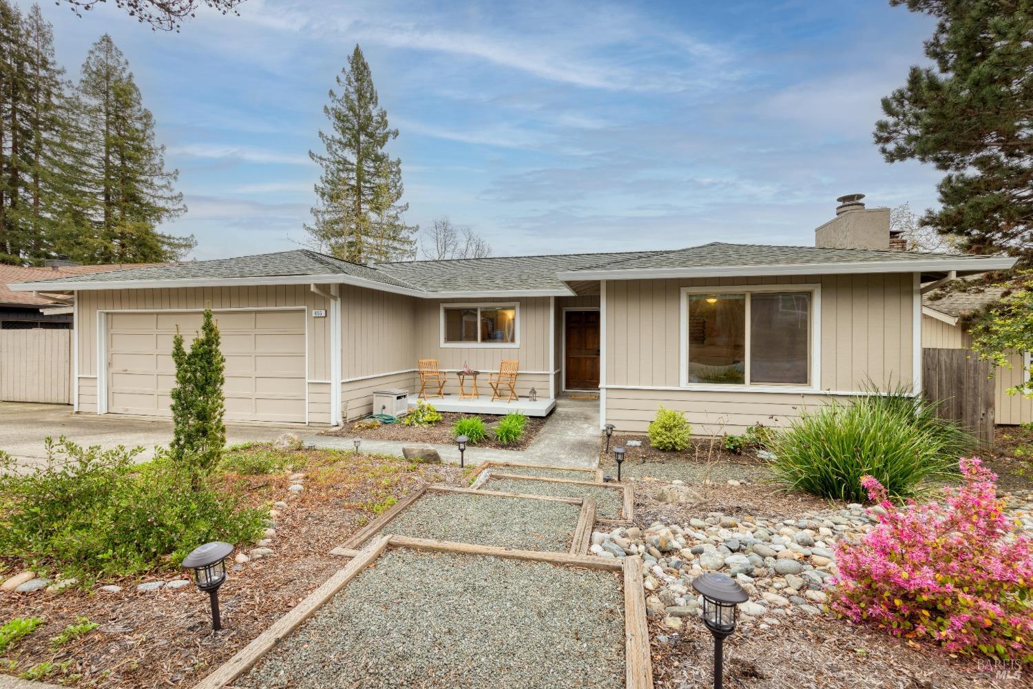 a front view of a house with garden