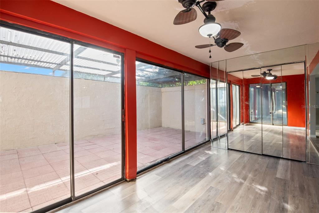 7500 Rocky Point Drive Hudson, FL 34667 - Photo 11 of 37 a view of a livingroom with a ceiling fan and window
