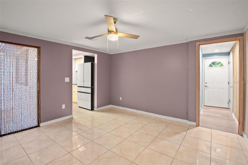7500 Rocky Point Drive Hudson, FL 34667 - Photo 18 of 37 an empty room with closet and fan chandelier