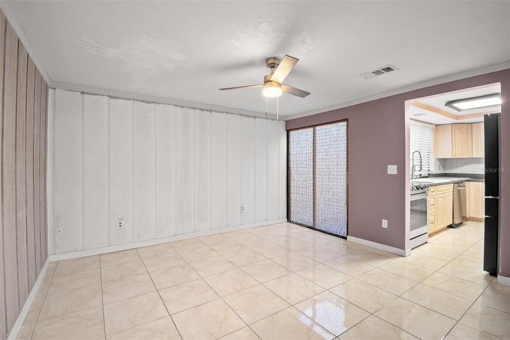 7500 Rocky Point Drive Hudson, FL 34667 - Photo 20 of 37 a view of a kitchen with granite countertop cabinets and chandelier fan