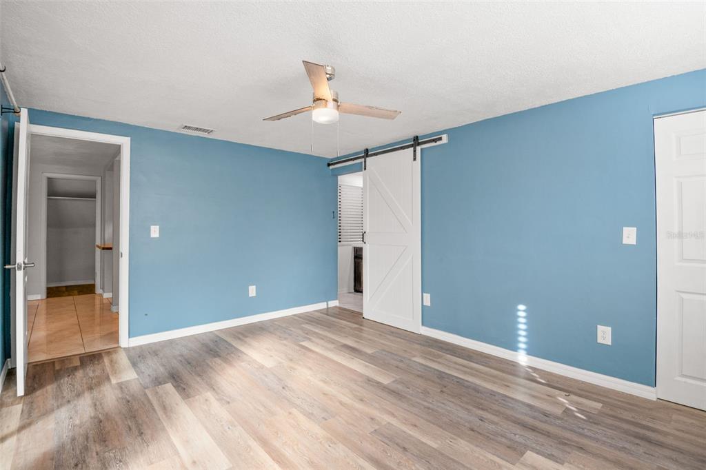 7500 Rocky Point Drive Hudson, FL 34667 - Photo 24 of 37 a view of an empty room with wooden floor