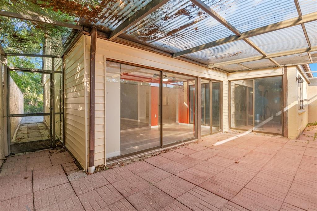 7500 Rocky Point Drive Hudson, FL 34667 - Photo 28 of 37 a view of a porch with a table and chairs