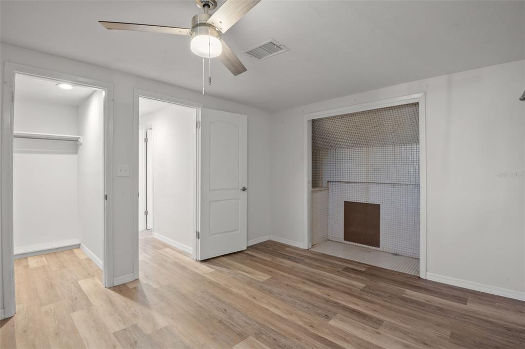 7500 Rocky Point Drive Hudson, FL 34667 - Photo 32 of 37 a view of empty room with wooden floor and fan