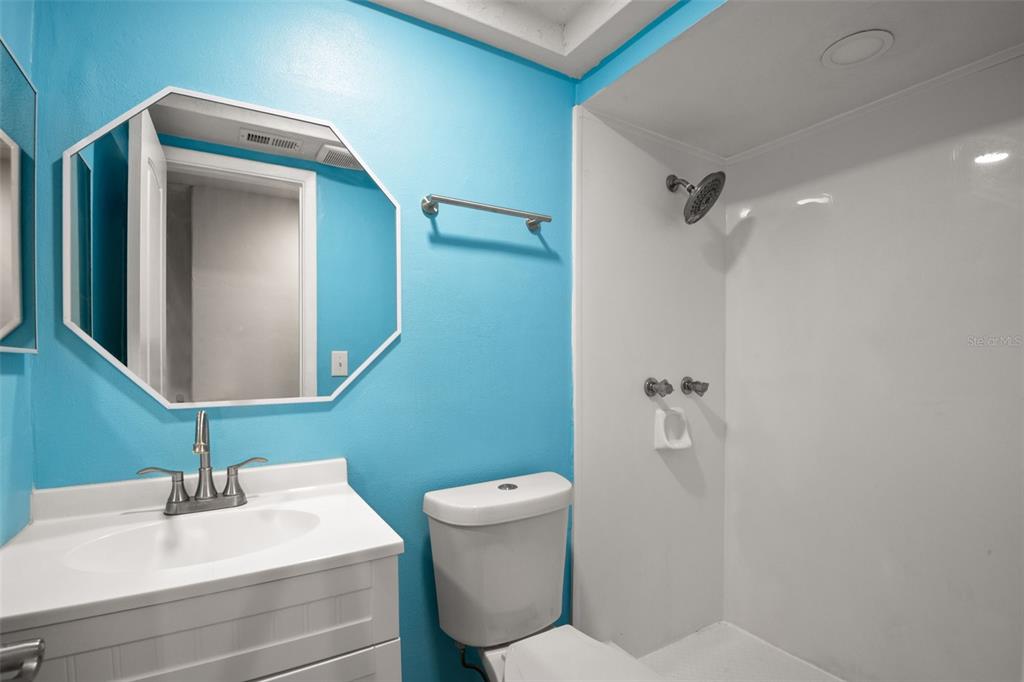 7500 Rocky Point Drive Hudson, FL 34667 - Photo 36 of 37 a bathroom with a sink a toilet and mirror