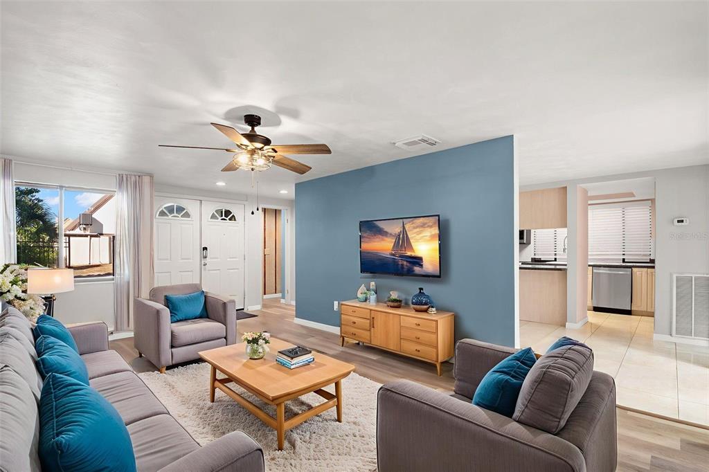 7500 Rocky Point Drive Hudson, FL 34667 - Photo 5 of 37 a living room with furniture and a flat screen tv