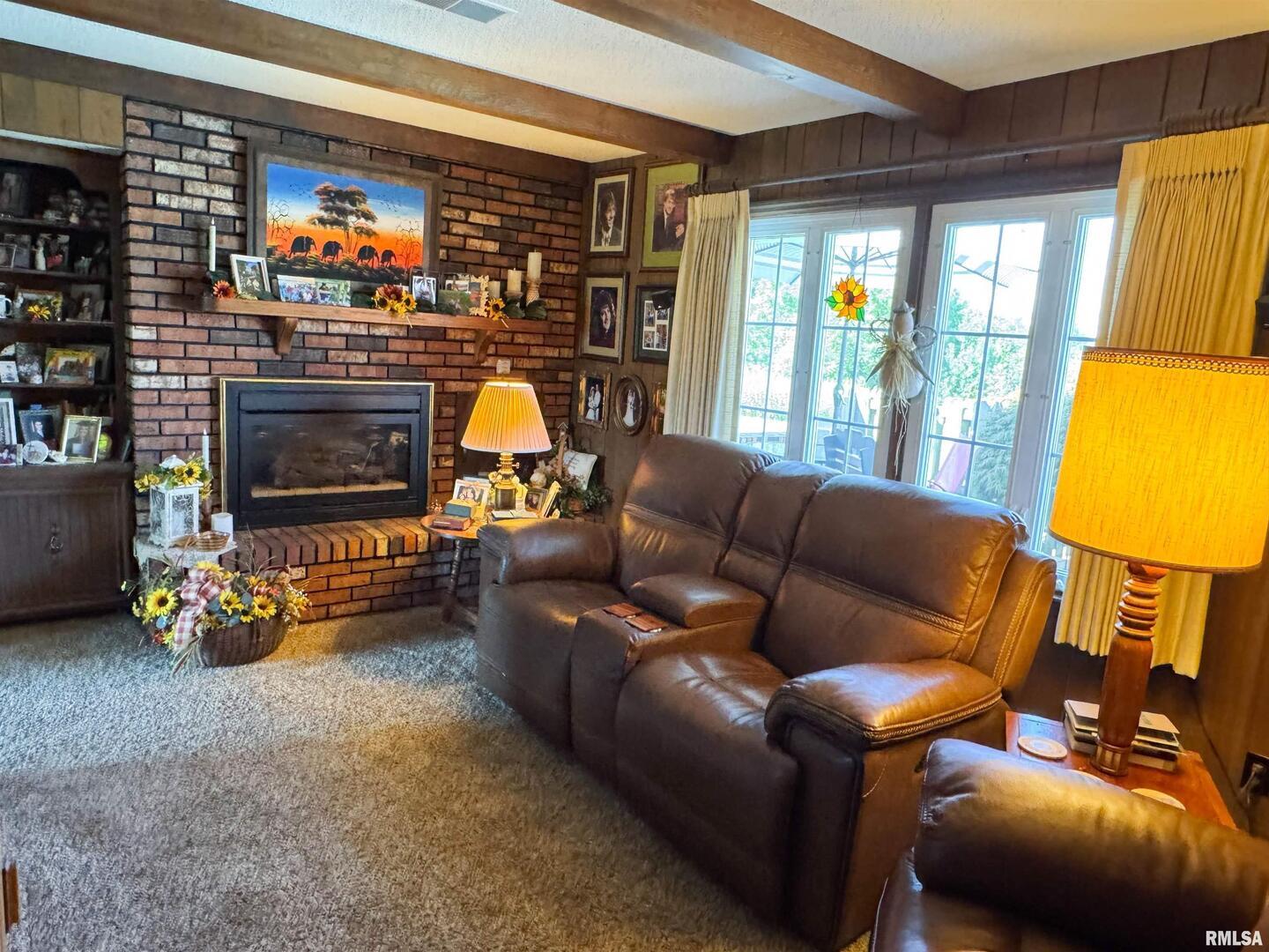 2885 State Route 146 Anna, IL 62906 - Photo 30 of 46 a living room with furniture a fireplace and a window
