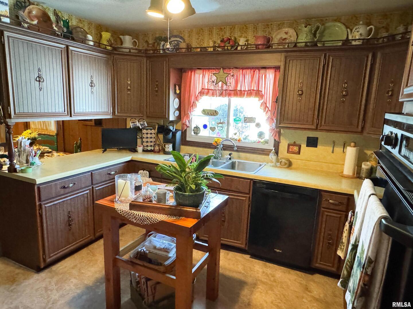 2885 State Route 146 Anna, IL 62906 - Photo 33 of 46 a kitchen with a sink cabinets and window