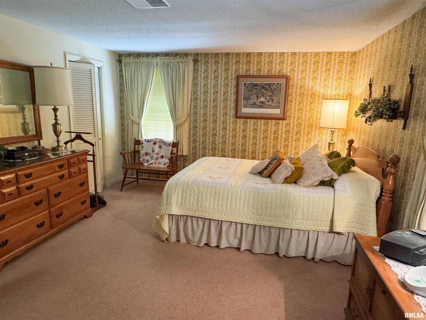 2885 State Route 146 Anna, IL 62906 - Photo 36 of 46 a bedroom with a bed and flat screen tv