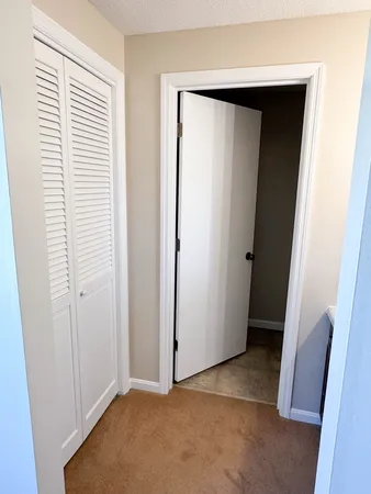 a view of a porch with a table and chairs