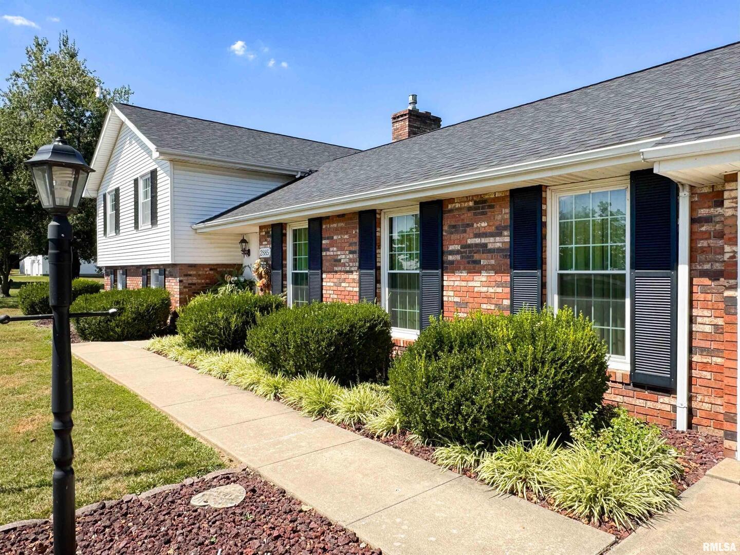 2885 State Route 146 Anna, IL 62906 - Photo 7 of 46 a front view of a house with garden