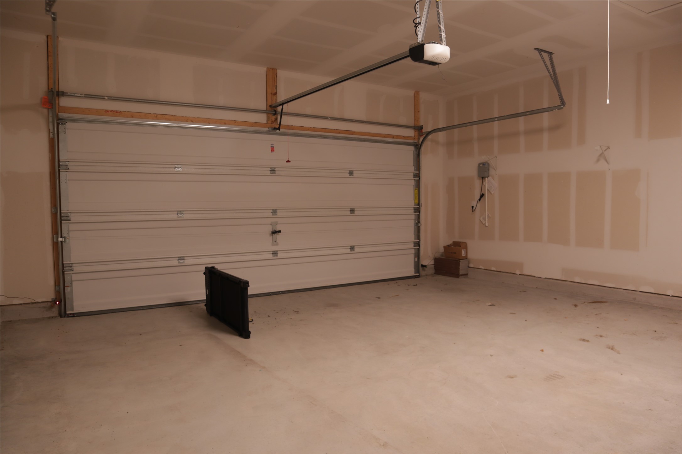 8111 Marigny Way Austin, TX 78744 - Photo 27 of 29 A well-maintained garage offers ample space for vehicles and storage with a convenient garage door opener.