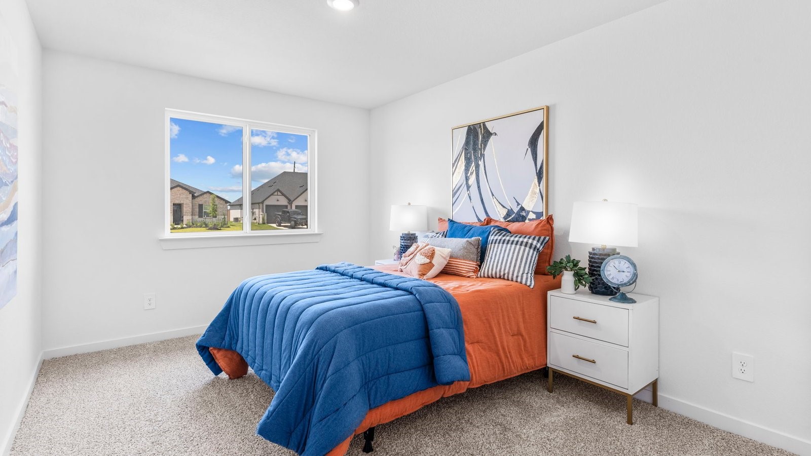 31319 Verona Ridge Drive Fulshear, TX 77441 - Photo 15 of 39 a bedroom with a bed and wooden floor