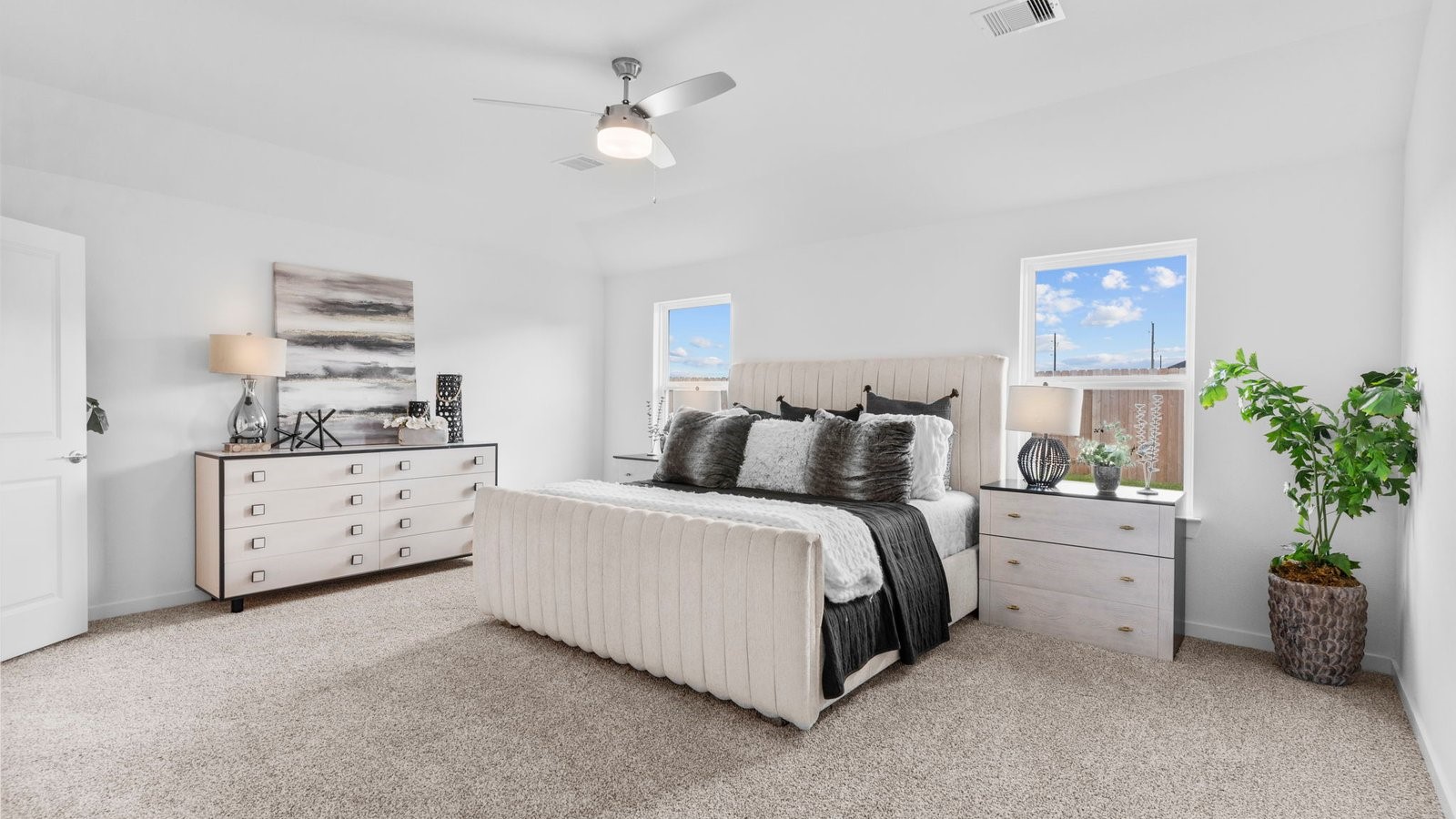 31319 Verona Ridge Drive Fulshear, TX 77441 - Photo 19 of 39 a bed room with a bed and a chandelier