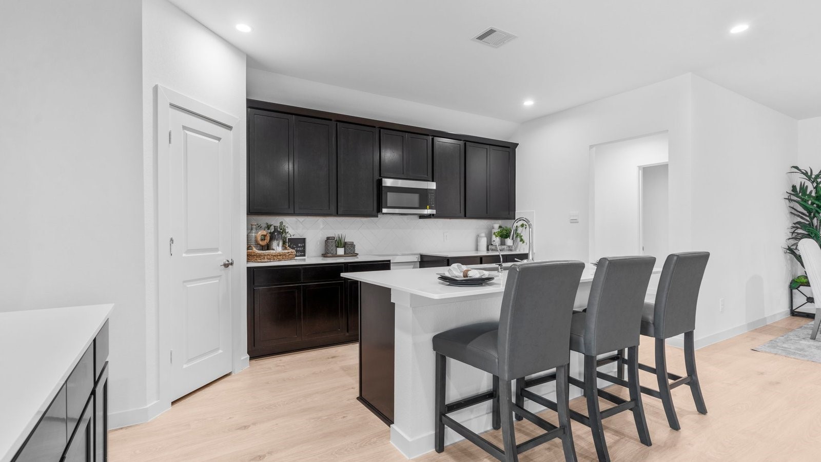 31319 Verona Ridge Drive Fulshear, TX 77441 - Photo 9 of 39 a kitchen with a sink cabinets and stainless steel appliances