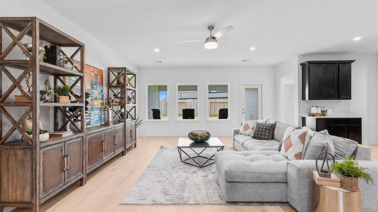 31319 Verona Ridge Drive Fulshear, TX 77441 - Photo 10 of 39 a living room with fireplace furniture and a flat screen tv