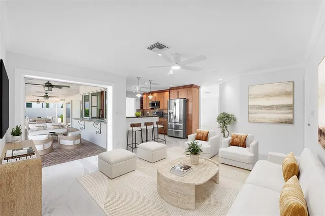 a kitchen with stainless steel appliances granite countertop a refrigerator and a stove