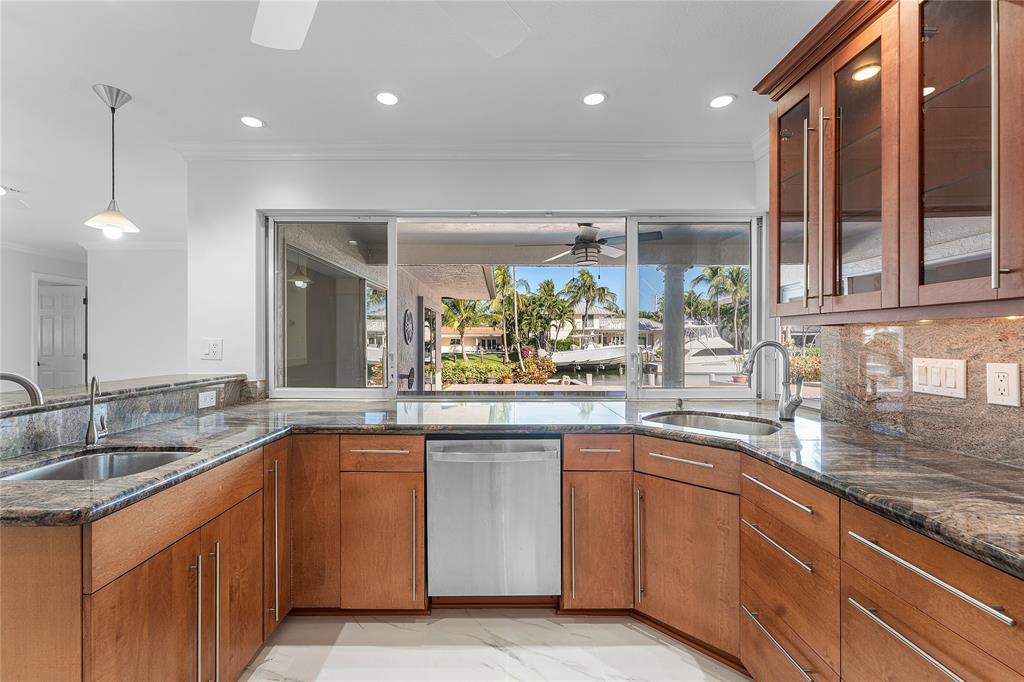 2443 Northeast 26th Street Lighthouse Point, FL 33064 - Photo 20 of 67 a kitchen with sink and cabinets