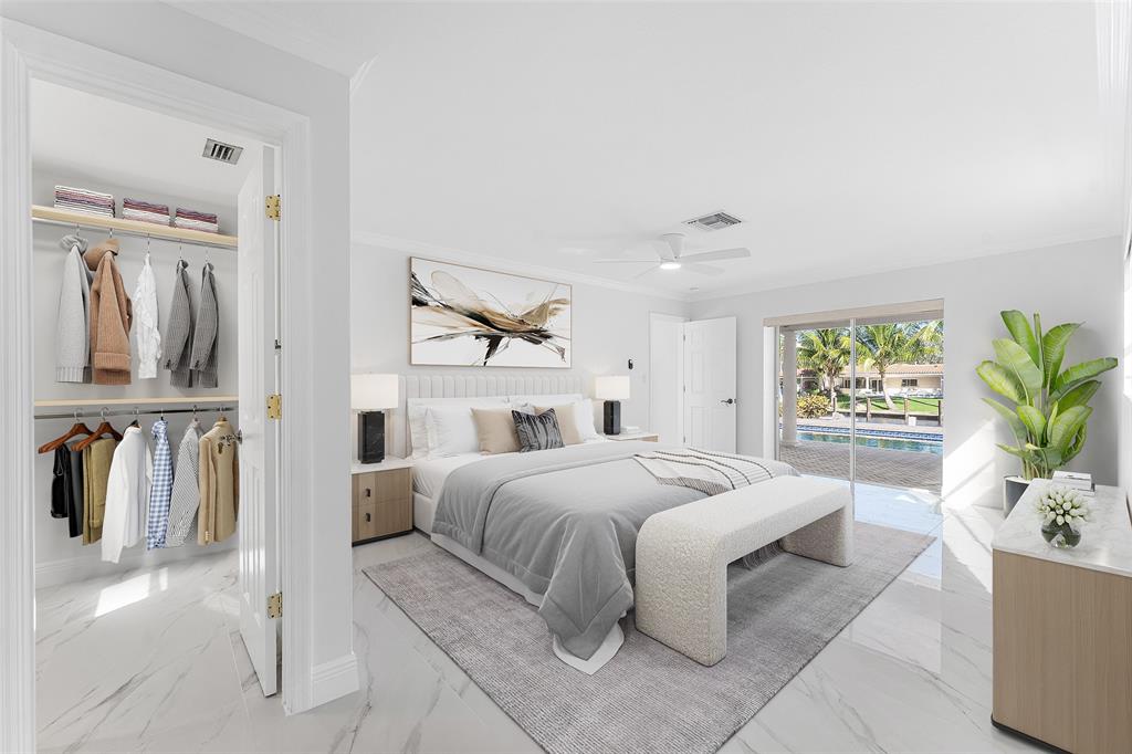 2443 Northeast 26th Street Lighthouse Point, FL 33064 - Photo 22 of 67 a bedroom with a bed and a window